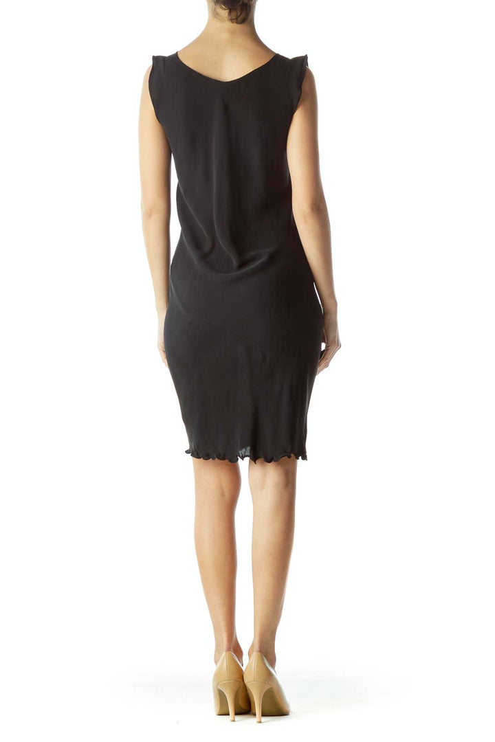 Back view of Shibori black sleeveless bodycon dress showing V-back and scalloped hem