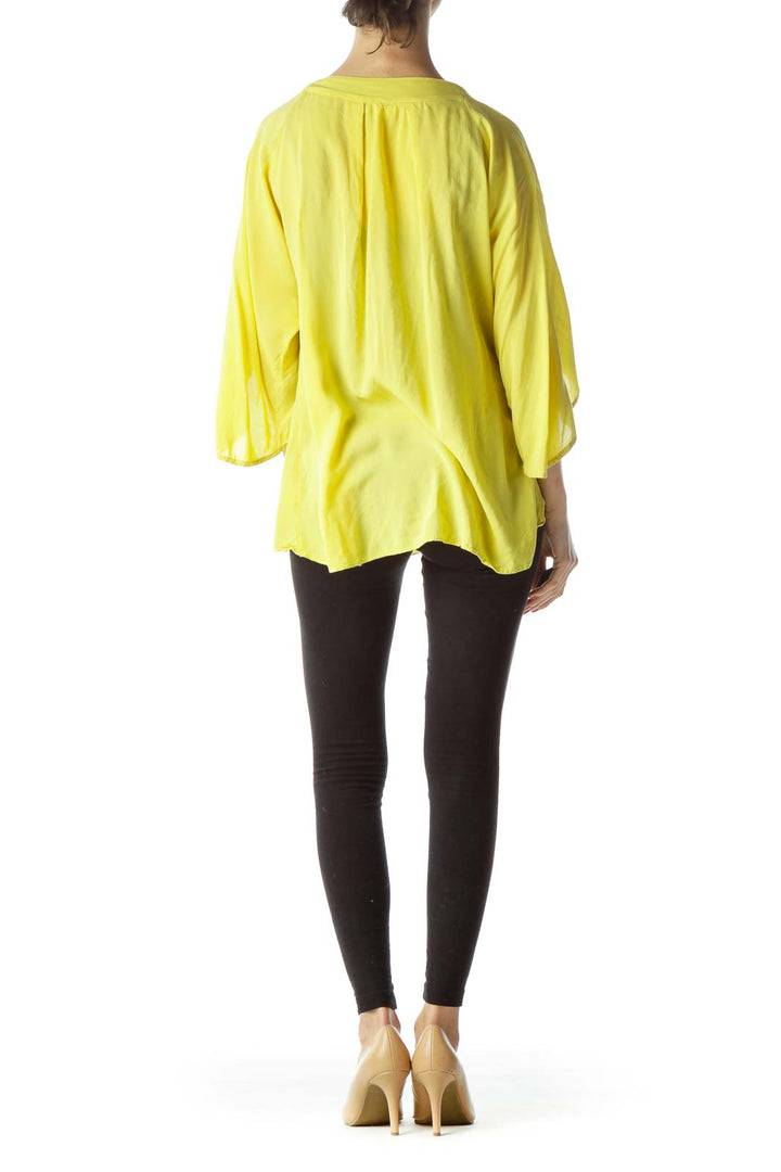 Back view of yellow Maeve top showing flowy design