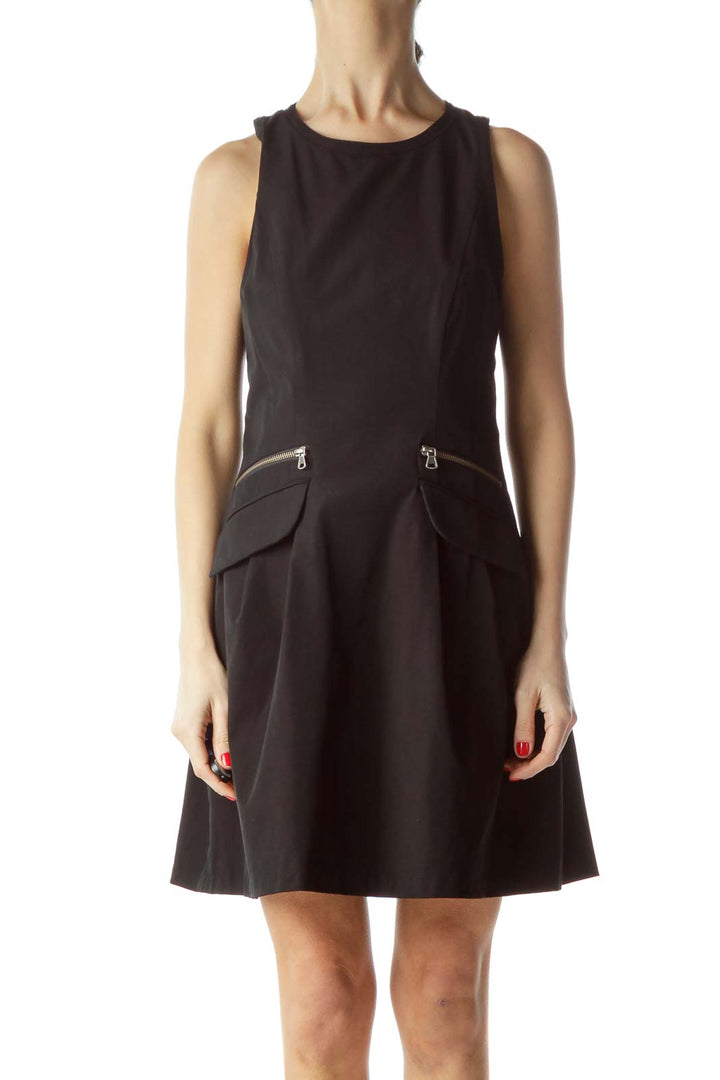 Front view of black sleeveless A-line dress by Nanette Lepore with zipper pocket details