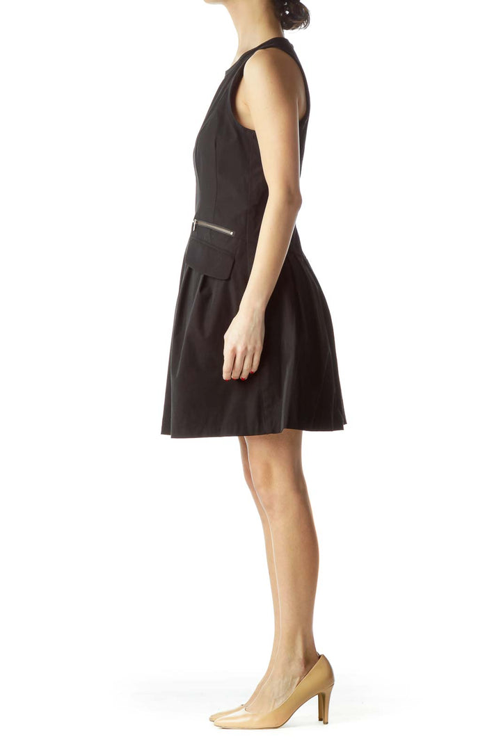 Front view of black sleeveless A-line dress by Nanette Lepore with zipper pocket details