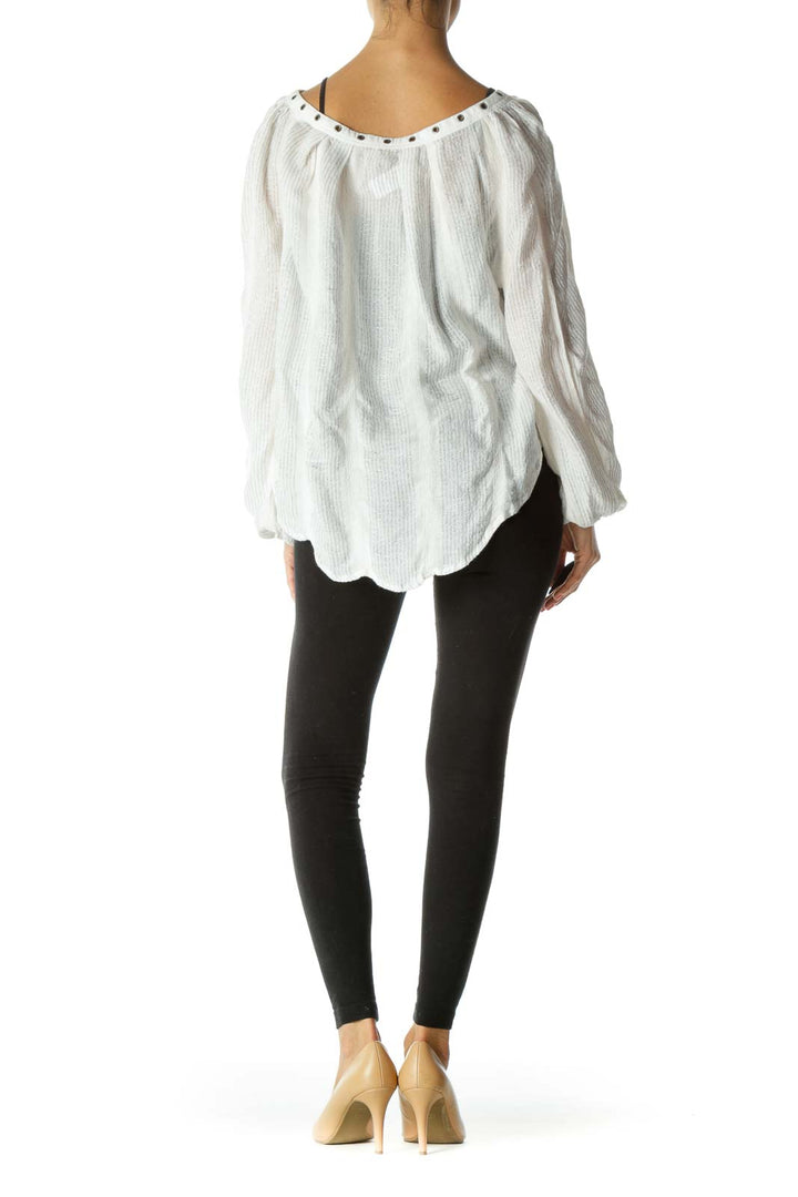 Back view of white Free People blouse showing flowy silhouette and gathered neckline