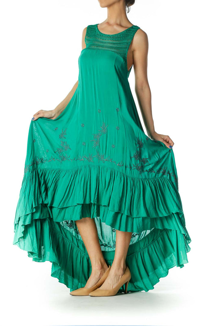 Front view of green Free People maxi dress with crochet neckline and embroidery