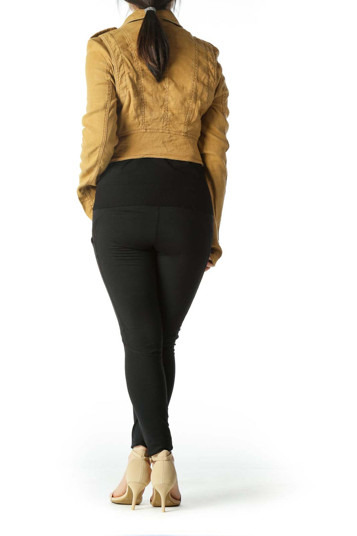 Back view of mustard Free People cropped moto jacket showing detailed stitching