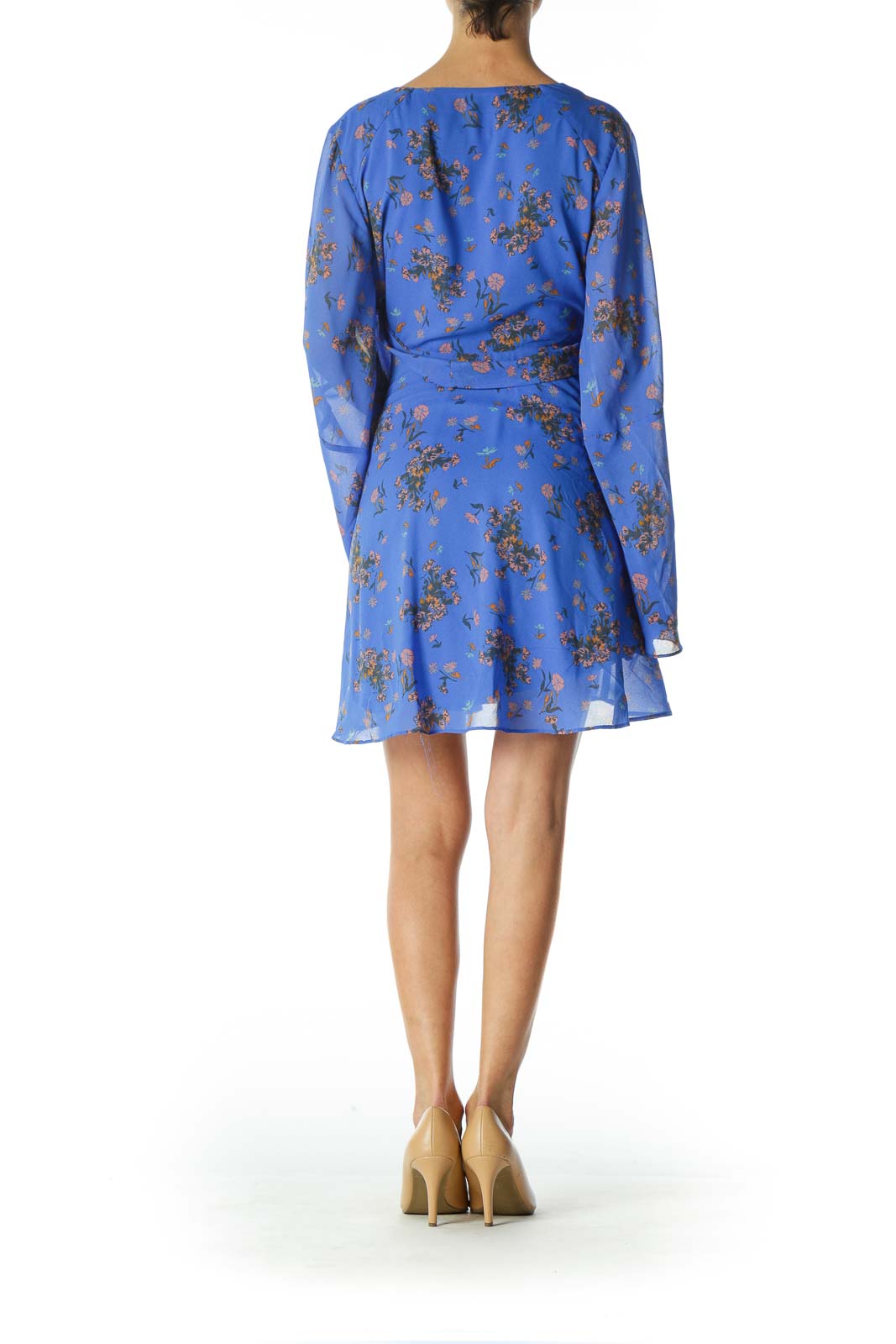 Back view of Free People blue floral long sleeve mini dress showing flowy silhouette