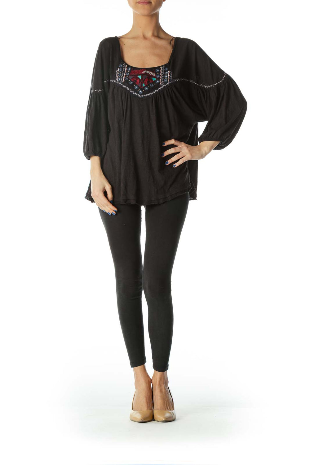 Front view of Free People black peasant top with colorful embroidery and flowy sleeves