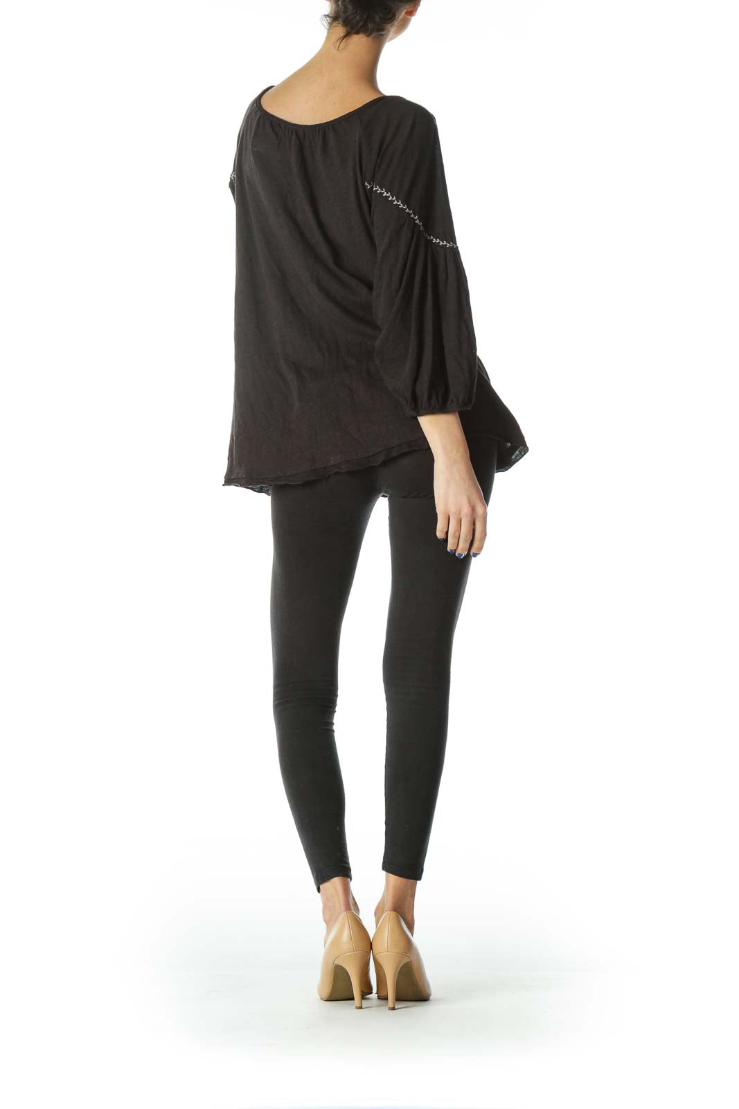 Back view of Free People black peasant top showing loose fit and long sleeves