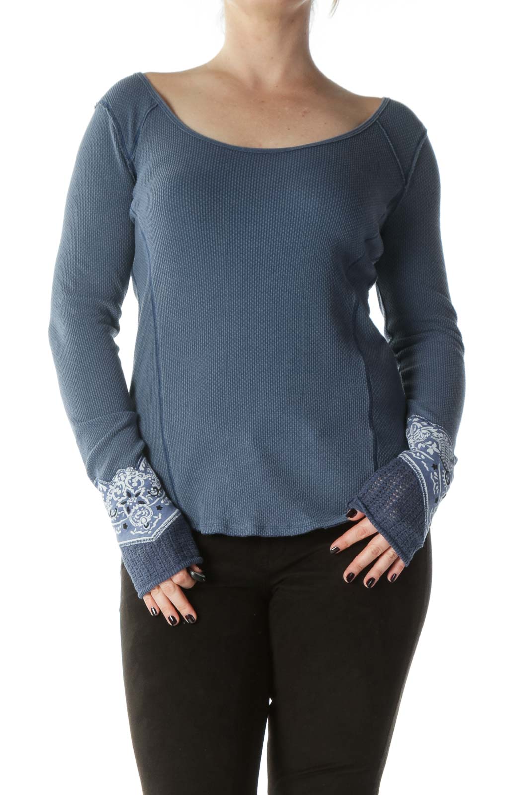 Front view of Free People blue waffle knit top with lace cuffs