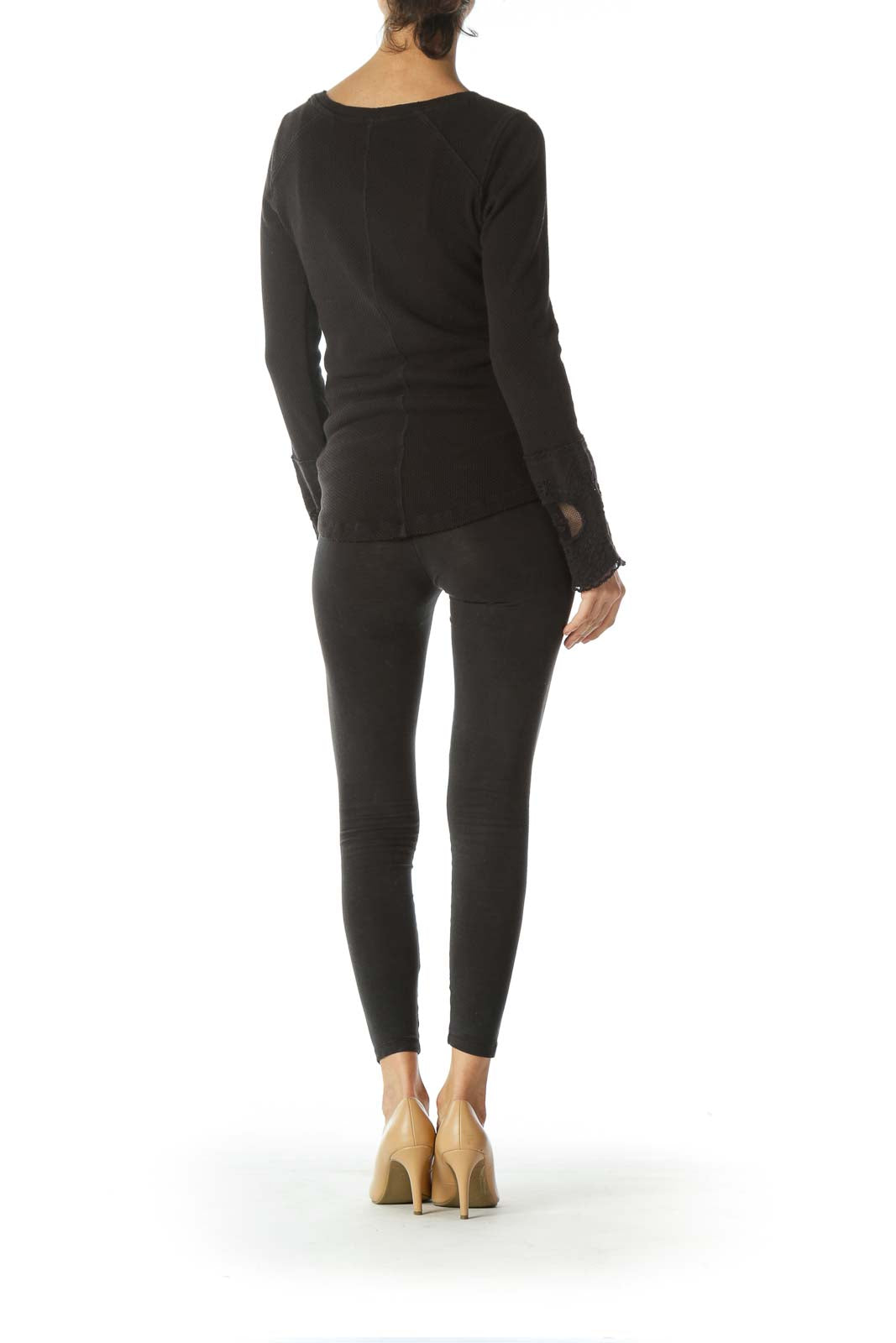 Back view of black Free People long sleeve top showing fitted silhouette