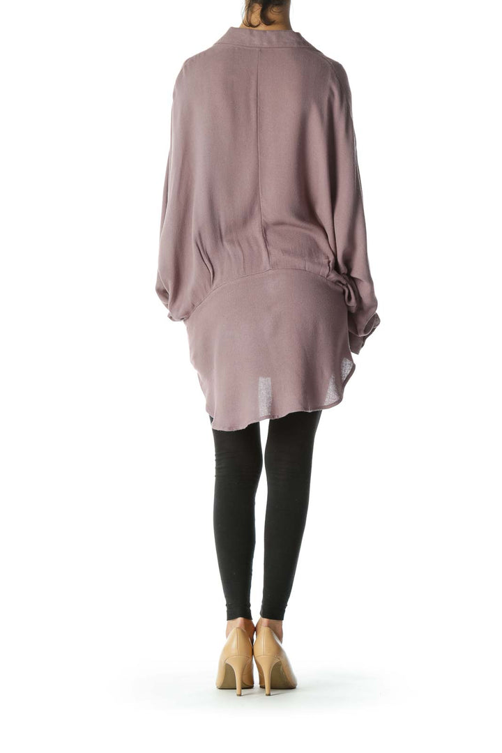 Back view of mauve Free People oversized button-down knit shirt showing high-low hemline