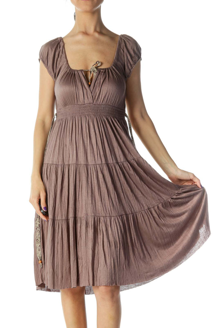 Front view of Free People taupe tiered midi dress with scoop neckline