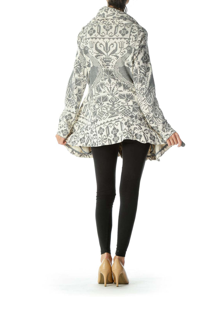 Back view of Free People gray and white patterned knit cardigan showing flared hem