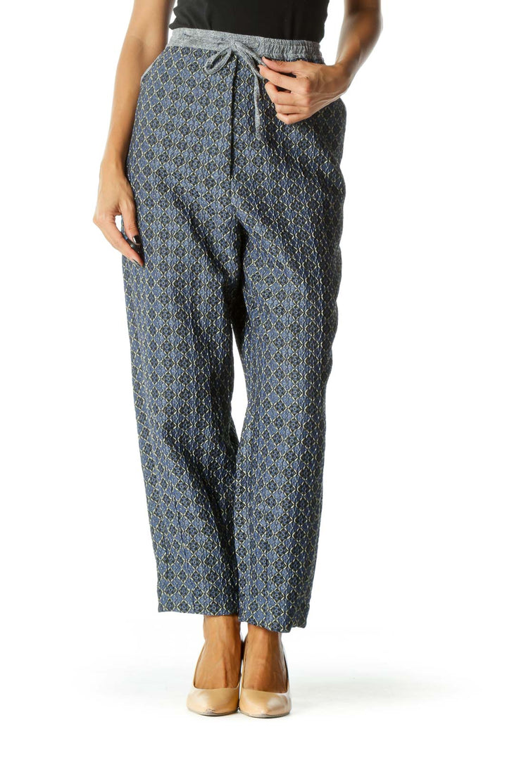 Front view of Free People blue patterned wide-leg pants with drawstring waist