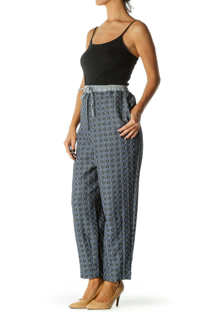 Front view of Free People blue patterned wide-leg pants with drawstring waist