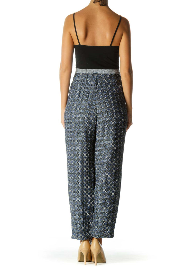 Back view of Free People blue patterned wide-leg pants showing full length and fit