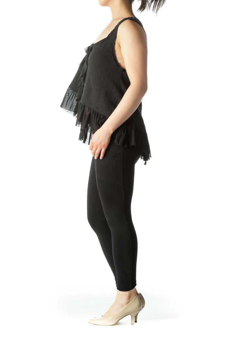 Front view of Free People black sleeveless top with ruffled details