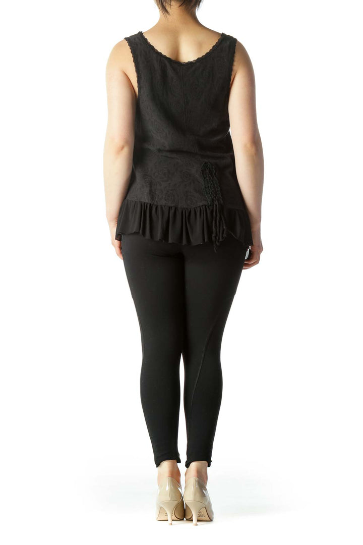 Back view of Free People black sleeveless top showing flowy silhouette