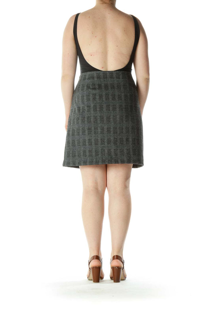 Back view of LOFT gray plaid knit skirt on model