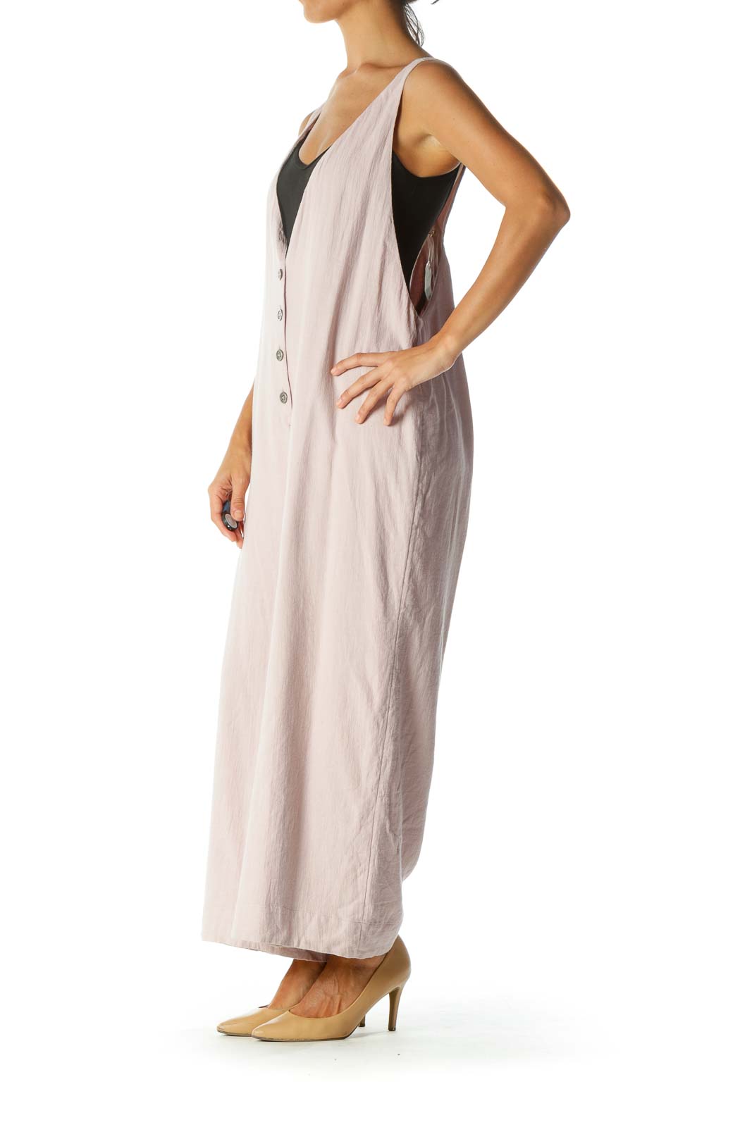 Front view of Free People blush pink sleeveless jumpsuit with button-front closure