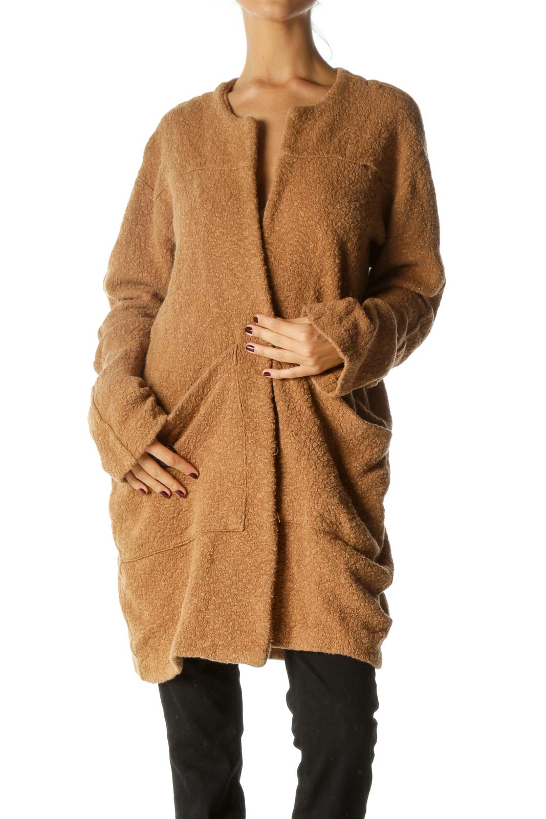 Front view of camel oversized knit cardigan from Free People