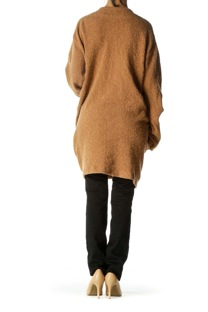 Back view of camel oversized knit cardigan from Free People