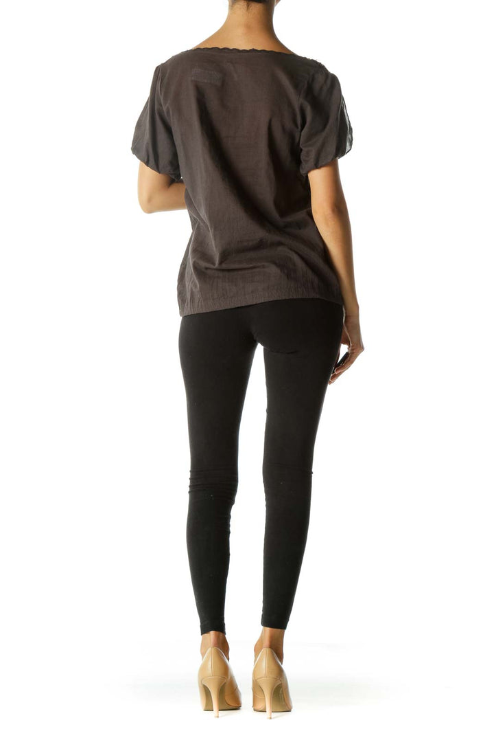 Back view of gray Free People peasant top showing relaxed fit