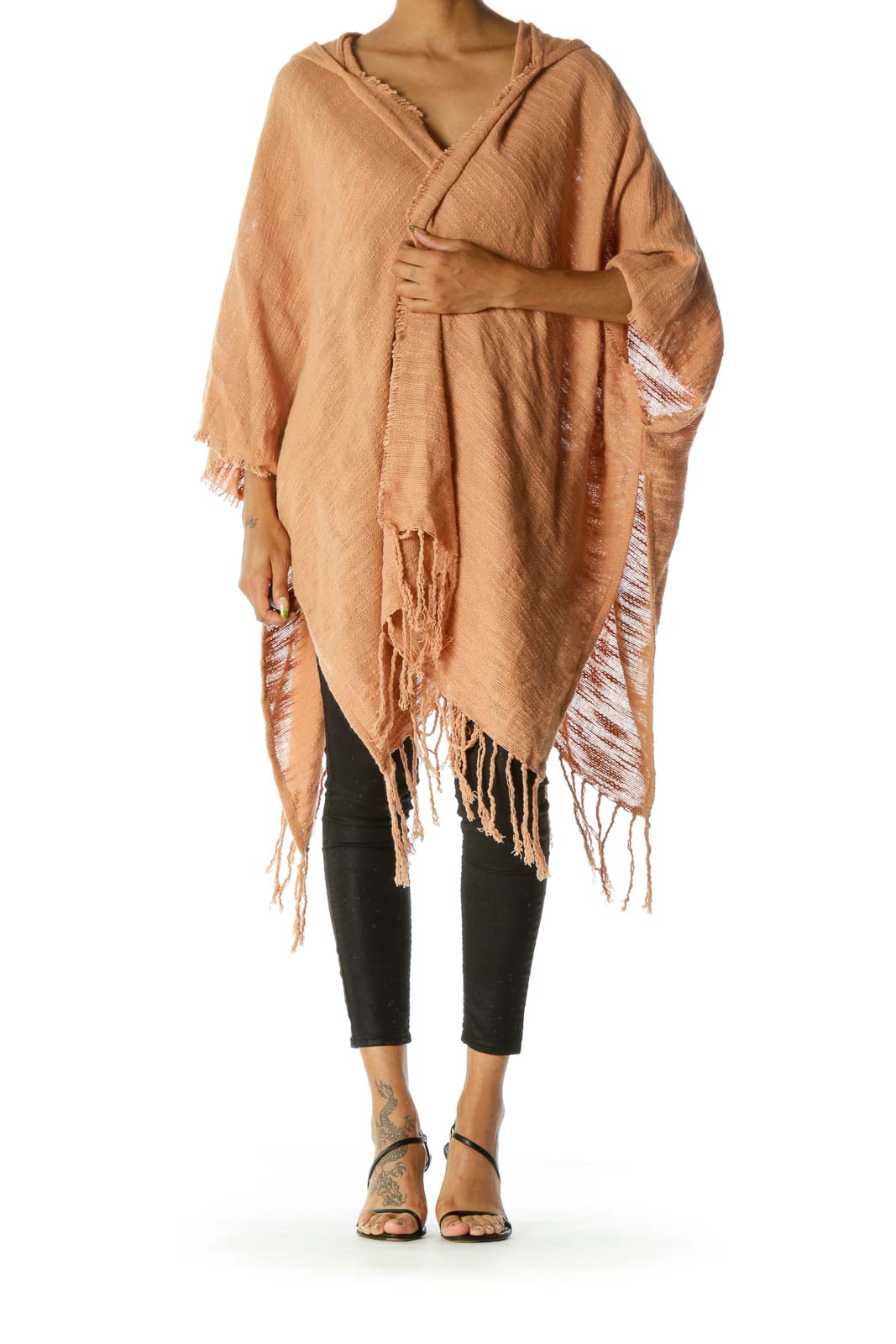 Front view of peach Free People fringed hooded poncho on model