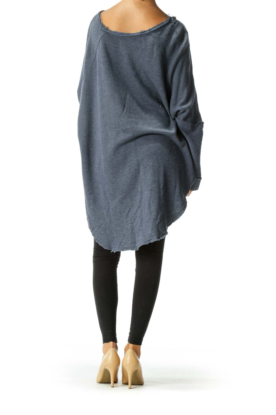 Back view of Free People blue oversized knit sweater showing relaxed fit and length