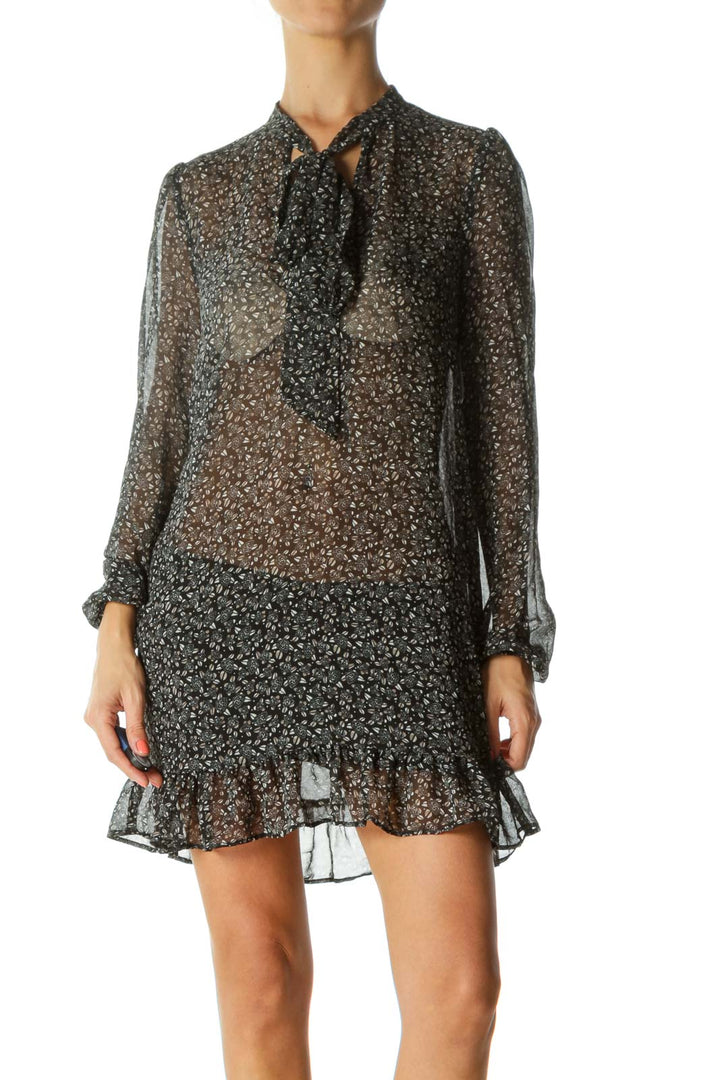 Front view of Free People black sheer floral mini dress with tie-neck