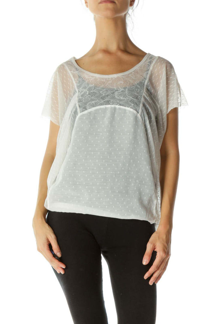 Front view of white sheer lace overlay top from Free People