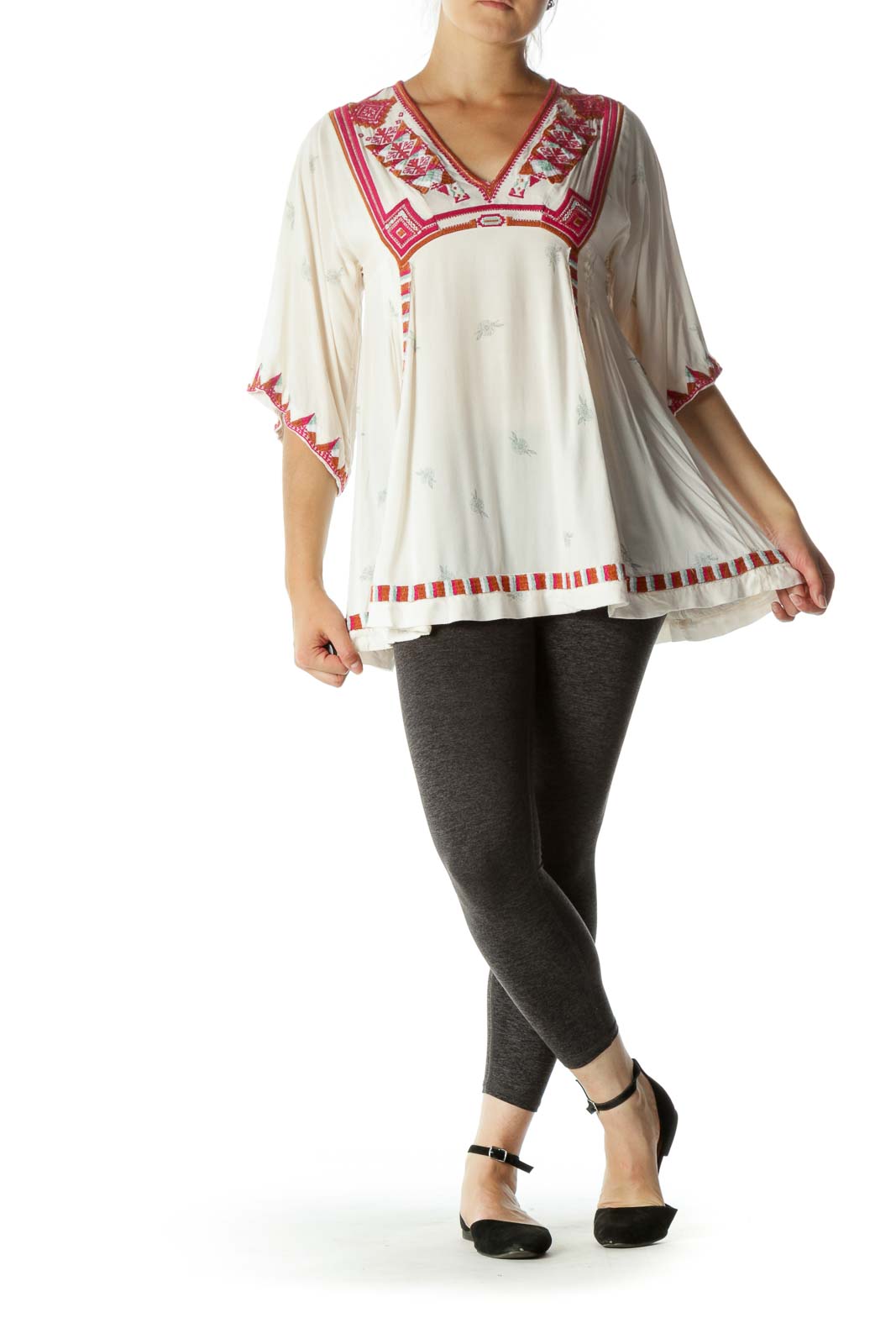 Front view of white Free People tunic top with red embroidery and V-neckline