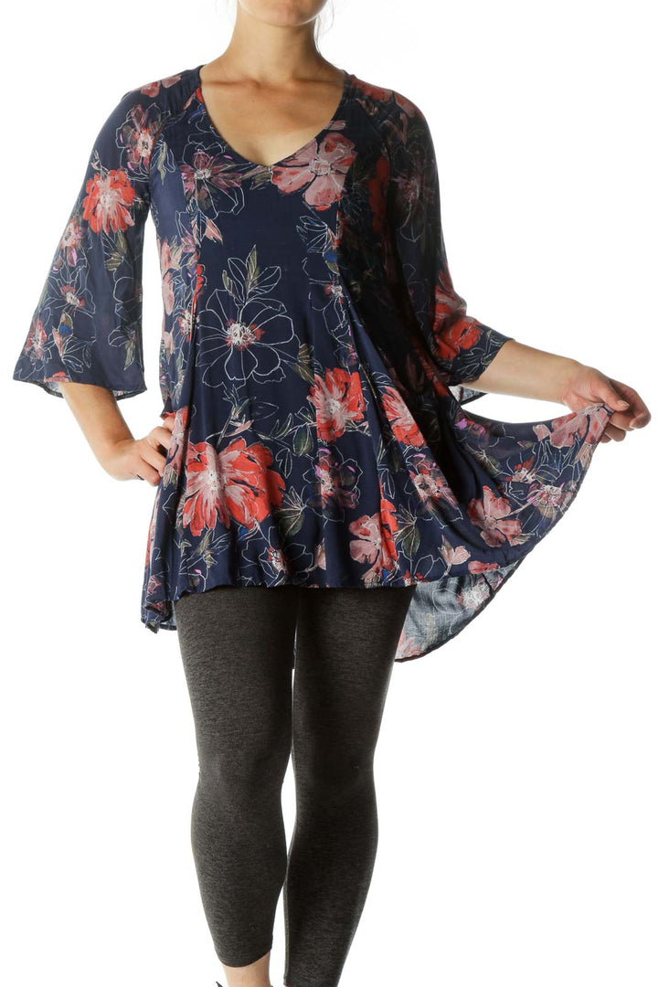 Front view of Free People navy floral tunic dress with bell sleeves