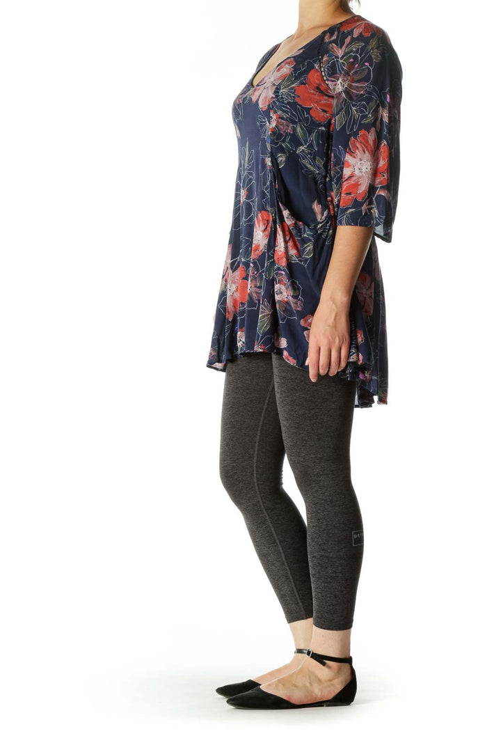 Front view of Free People navy floral tunic dress with bell sleeves