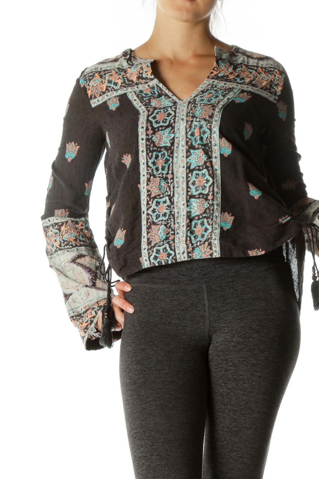 Front view of Free People gray floral top with embroidered V-neck and bell sleeves