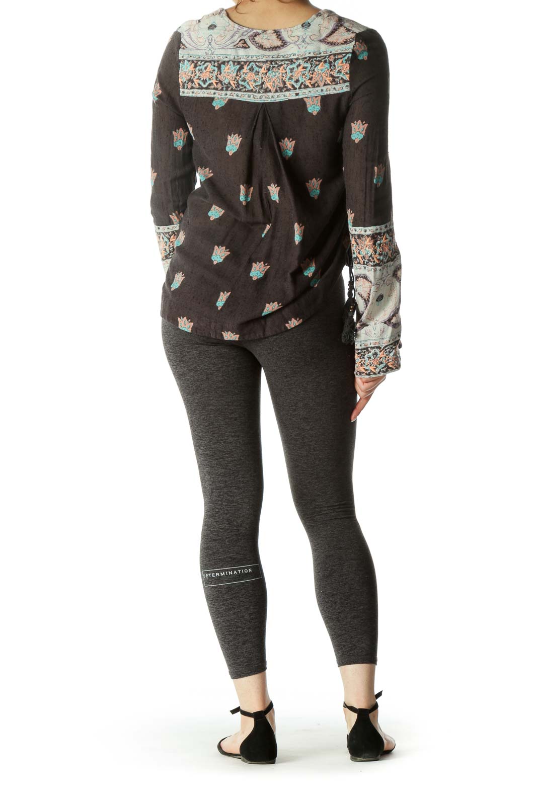 Back view of Free People gray floral top showing relaxed fit and high-low hem