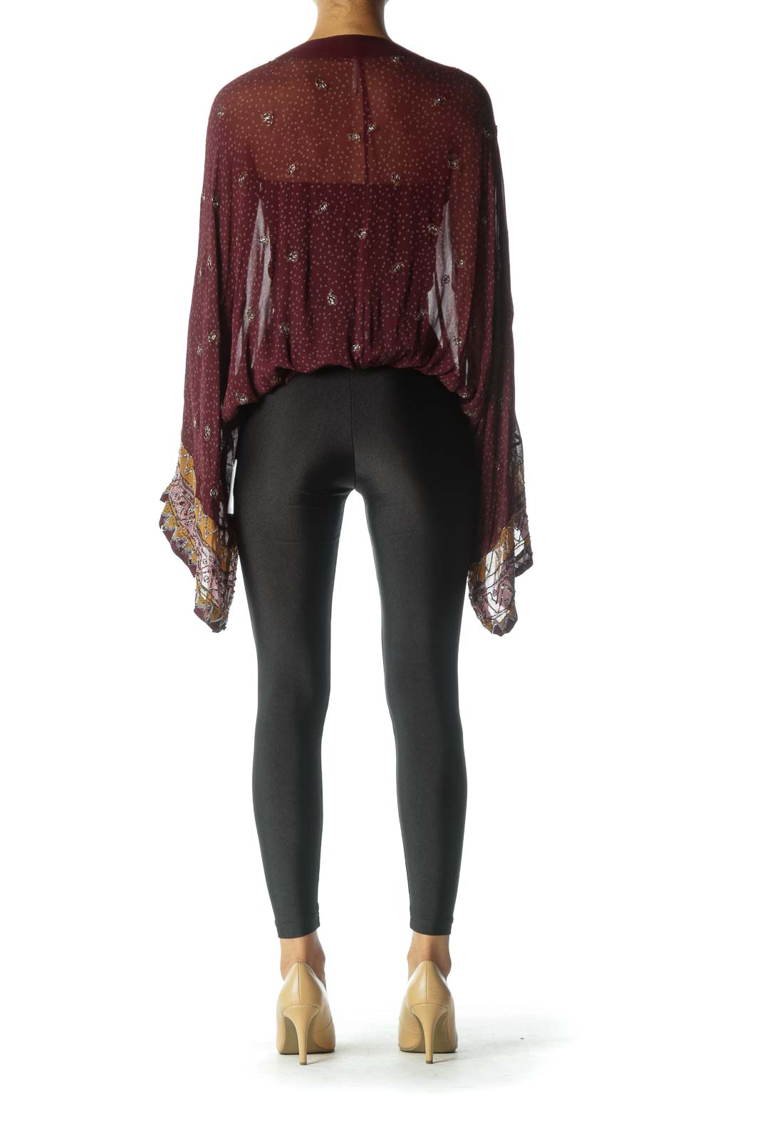 Back view of burgundy Free People top showing flowy silhouette and patterned bell sleeves