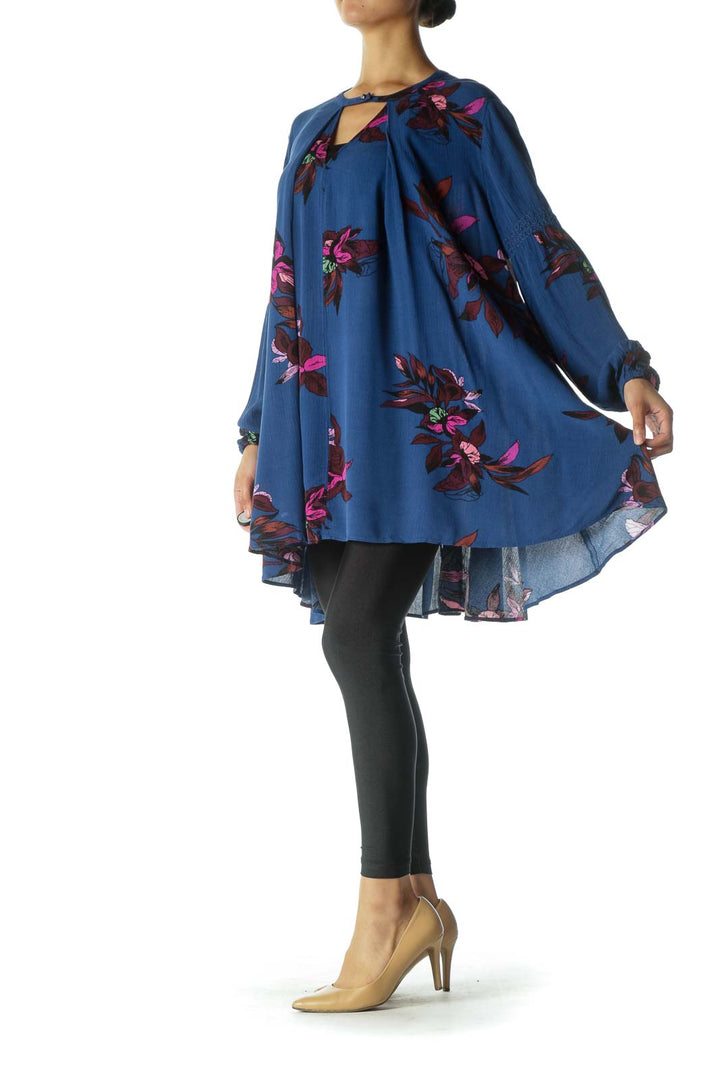 Front view of Free People blue floral tunic top with V-neckline