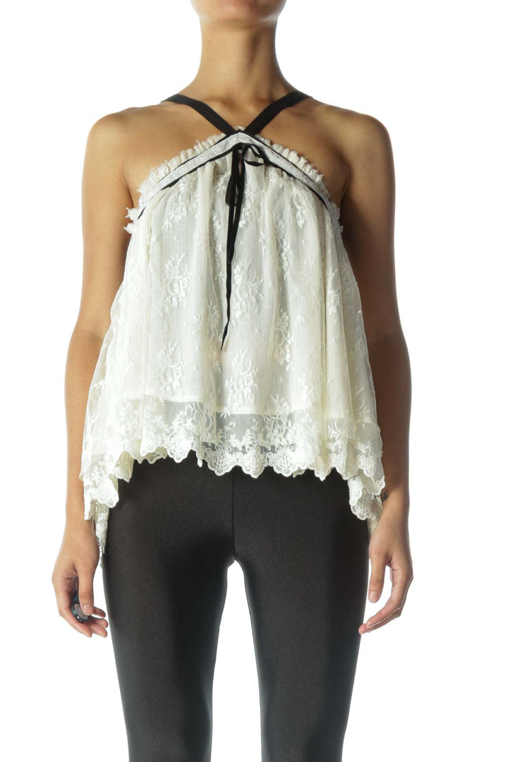 Front view of Free People white lace halter top with black straps