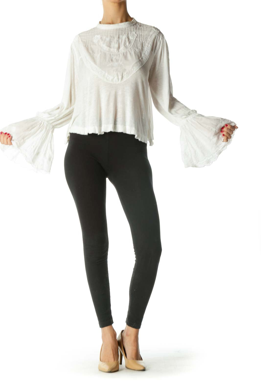 Front view of white Free People crop top with embroidered yoke and bell sleeves