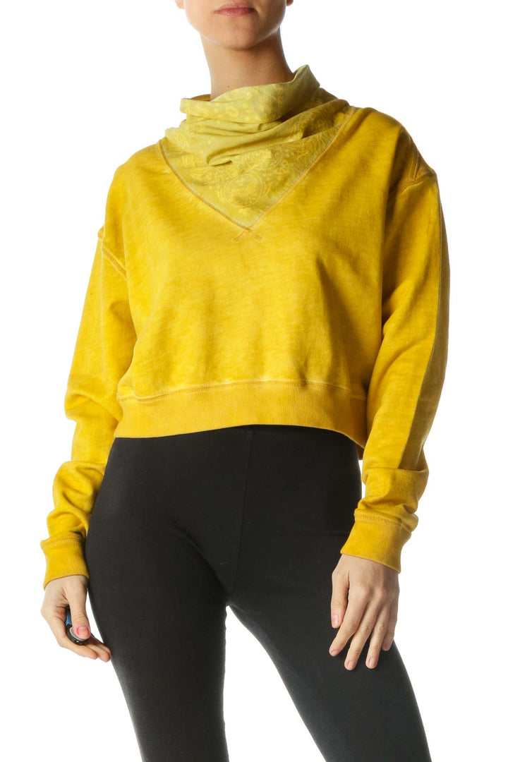 Front view of yellow Free People cropped sweatshirt with cowl neck