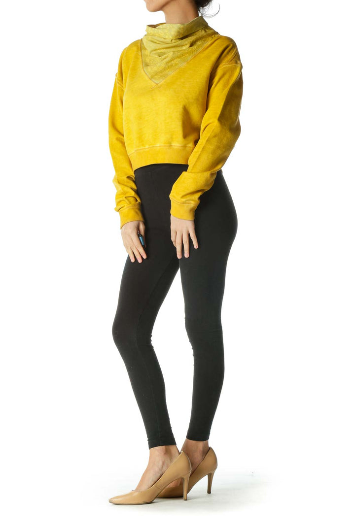 Front view of yellow Free People cropped sweatshirt with cowl neck