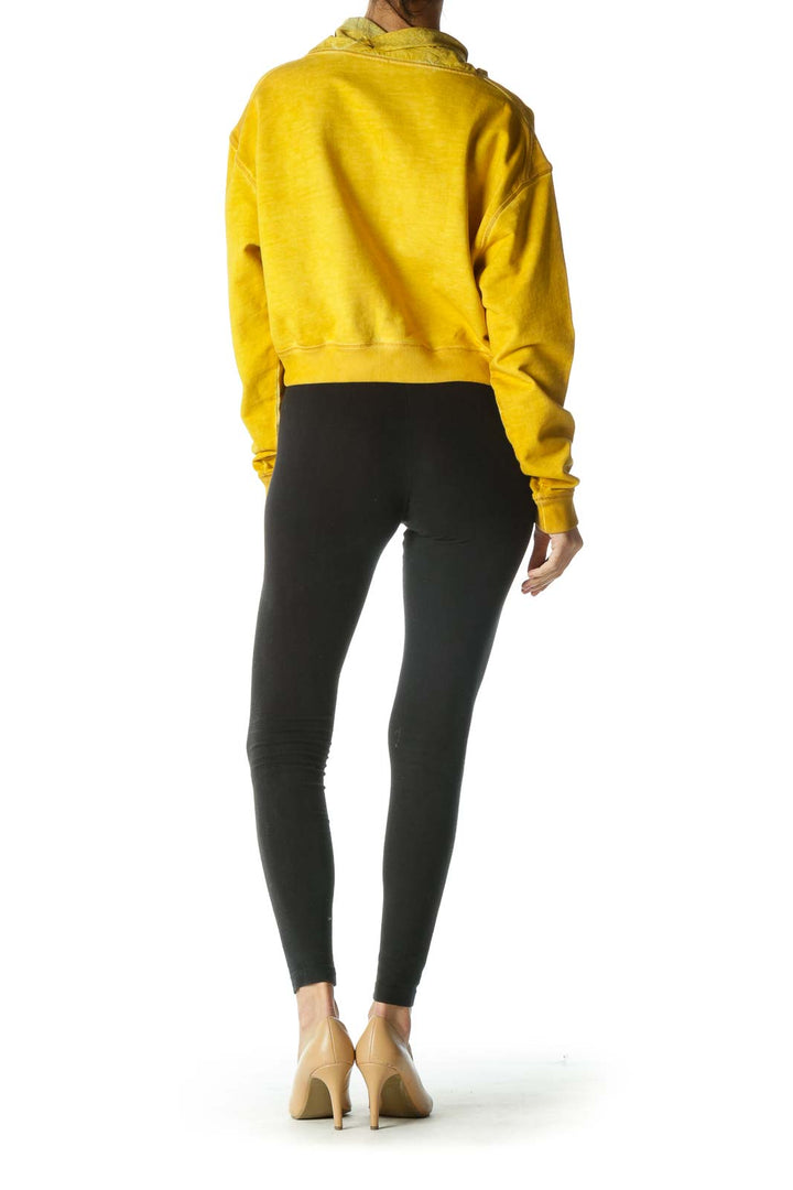 Back view of yellow Free People cropped sweatshirt on model