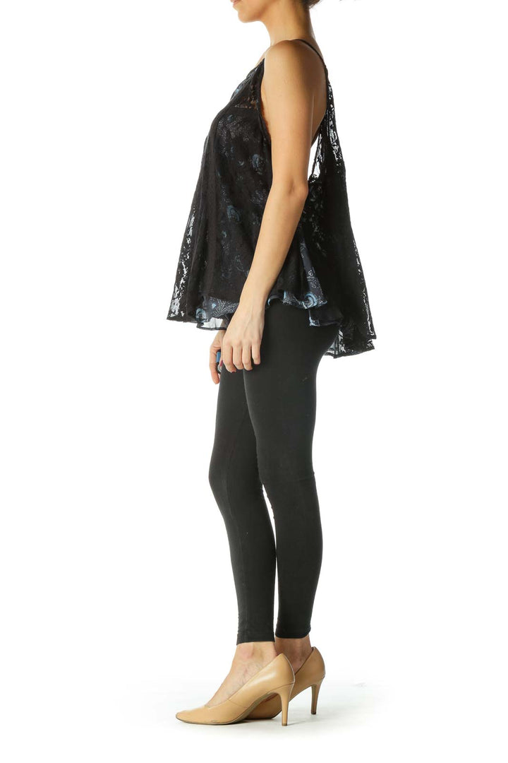 Front view of Free People black floral lace sleeveless top on model