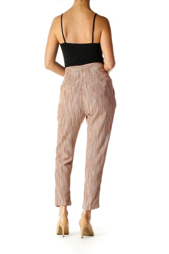 Back view of Free People beige striped drawstring pants on model