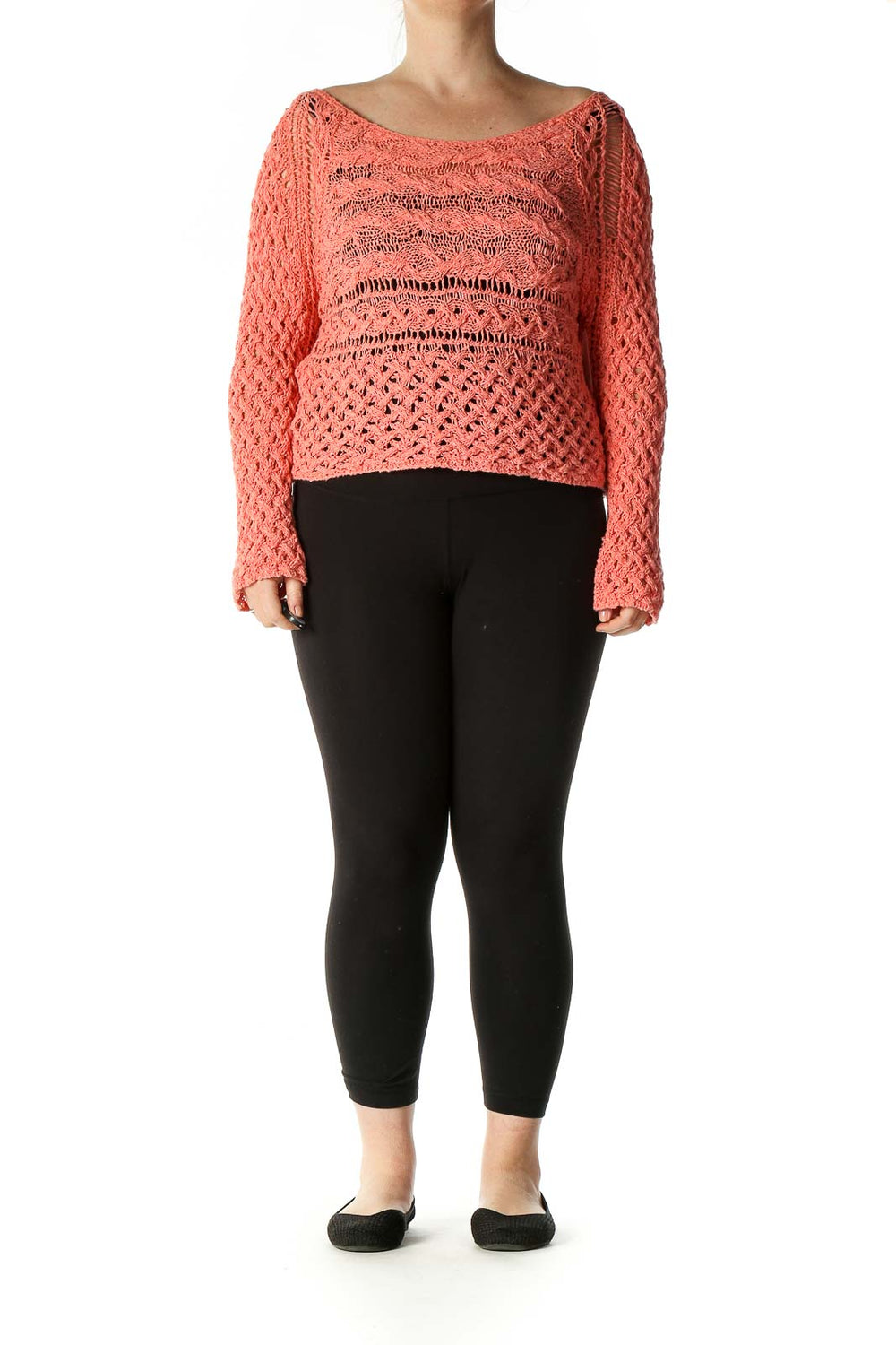 Front view of Free People coral crochet knit crop sweater with intricate open-knit pattern