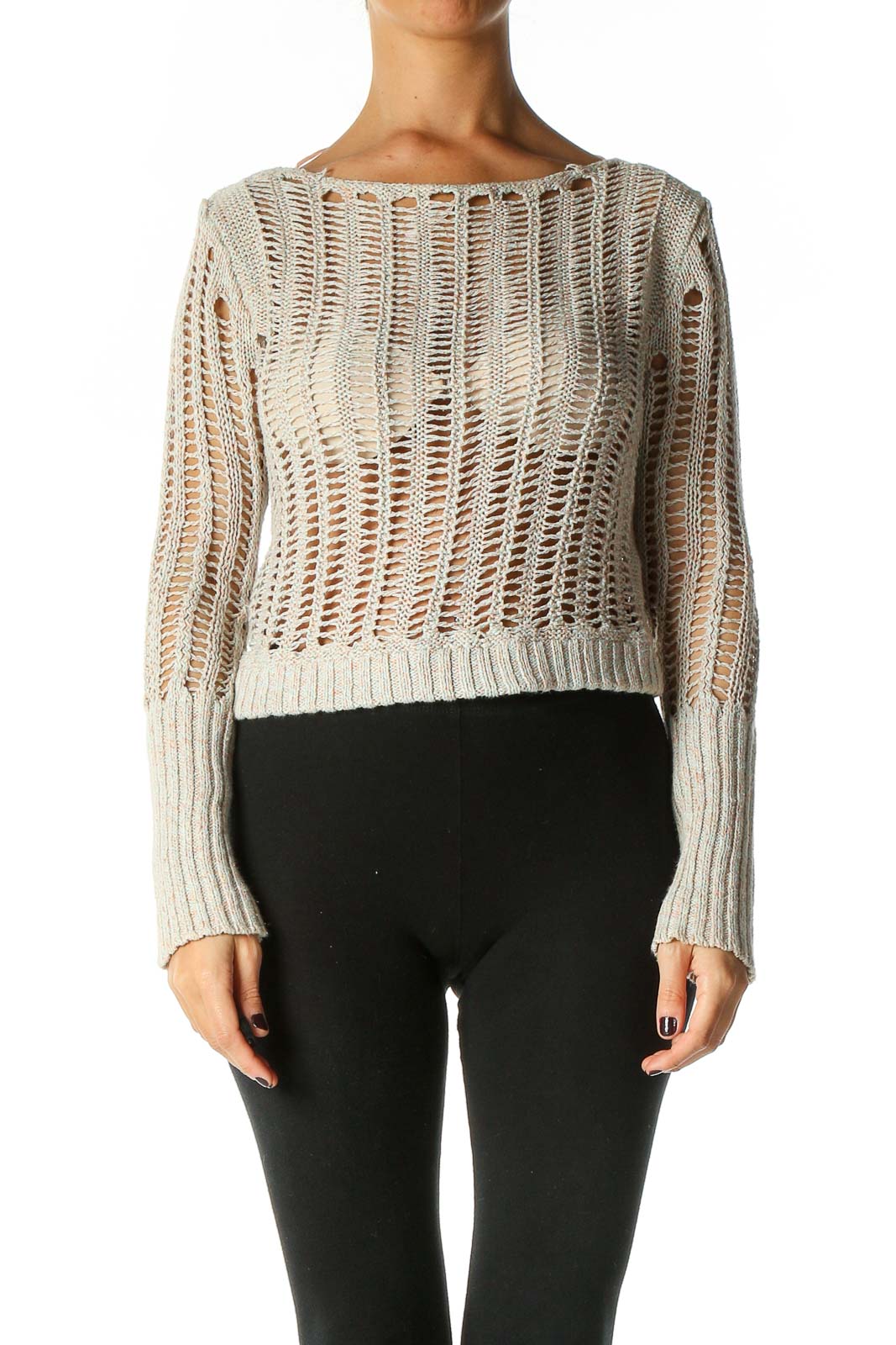 Front view of Free People beige open knit cropped sweater on model