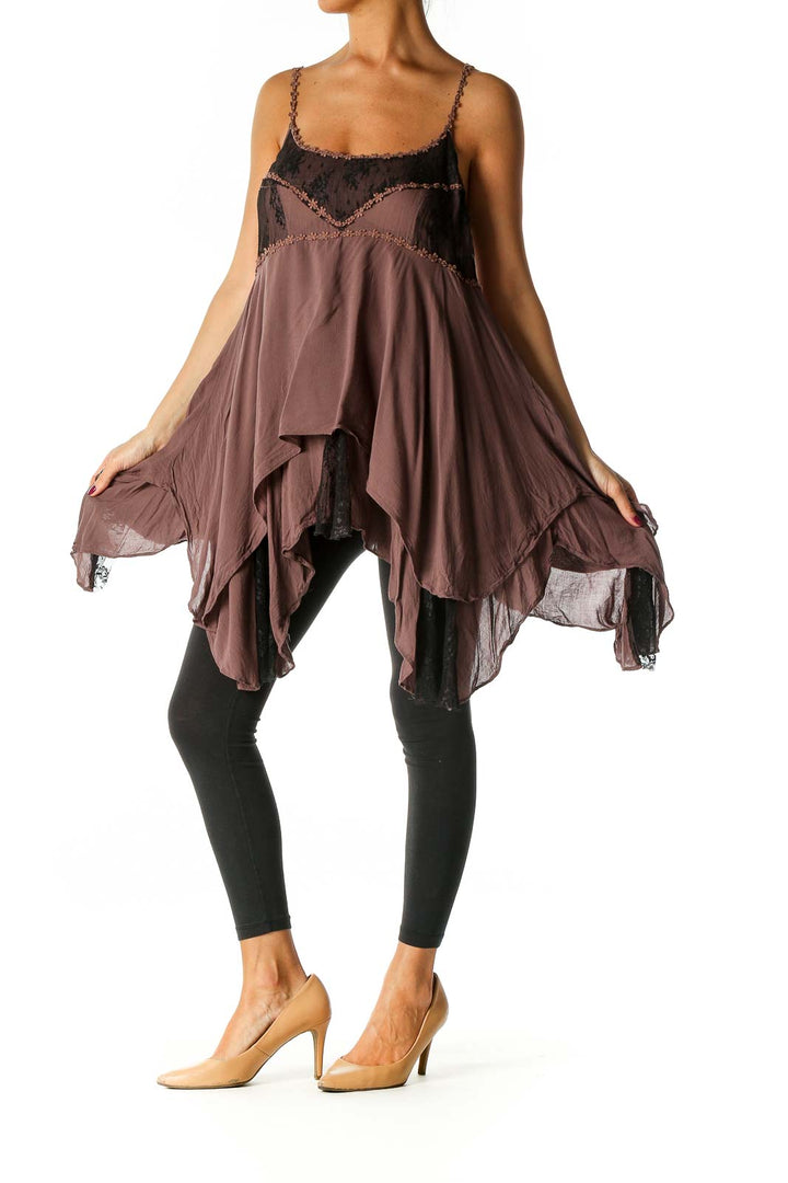 Front view of brown Free People camisole top with lace trim and asymmetrical hem