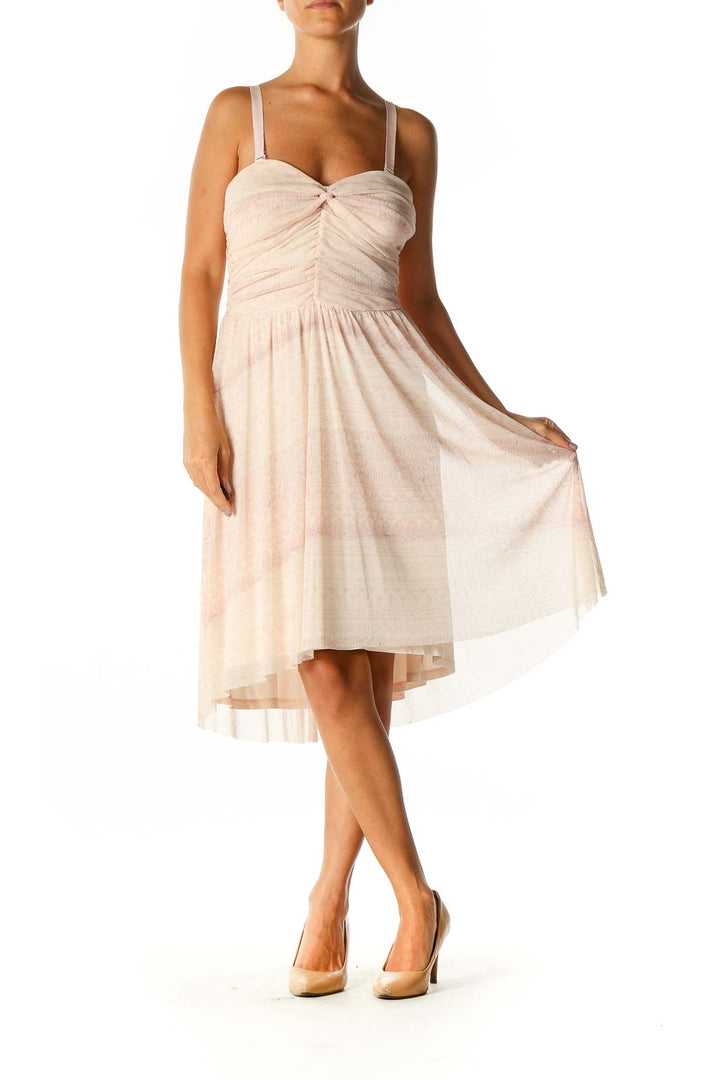 Front view of blush Free People midi dress with ruched bodice and sweetheart neckline