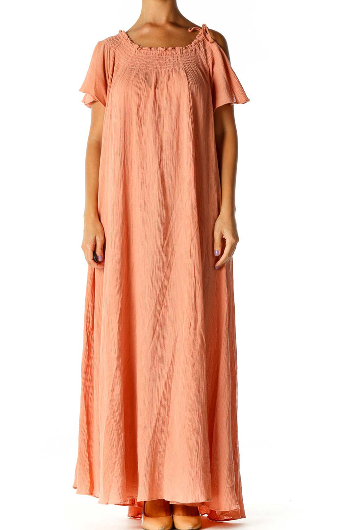 Front view of Free People peach off-shoulder maxi dress with flowy silhouette