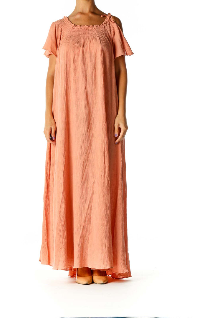 Front view of Free People peach off-shoulder maxi dress with flowy silhouette