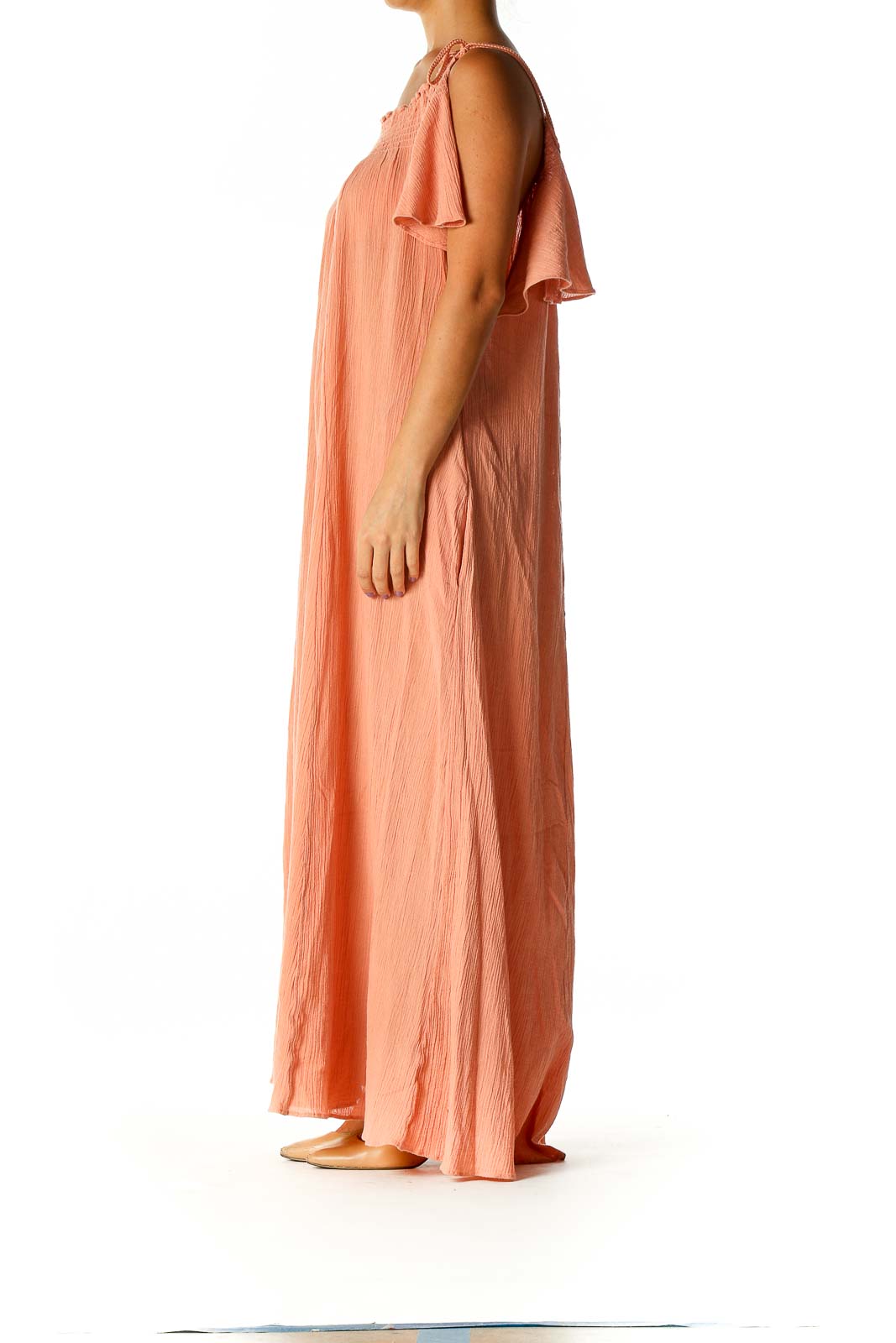 Front view of Free People peach off-shoulder maxi dress with flowy silhouette